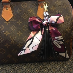 Purse scarf braided bow tassel charm , gold  clip  on bag handle hardware . Great  charm accessory. Plum black white colors - special order