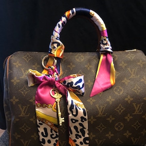 Purse scarf set,  2 vibrant pink multi color design + matching braided gold key  clip  on bag charm