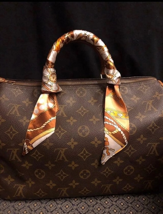 Monogram Speedy 35 and Artsy MM with twilly scarves on the handles