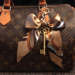 Louis Vuitton Braided Handle With Colorful Leather Charm