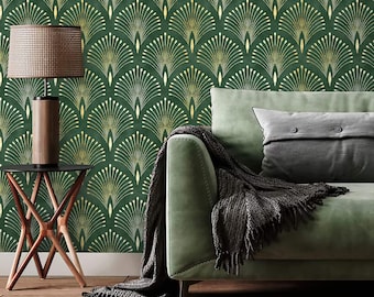 May include: A green velvet sofa with a gray throw blanket and a pillow. The sofa is in front of a wall with a green and gold geometric wallpaper pattern.