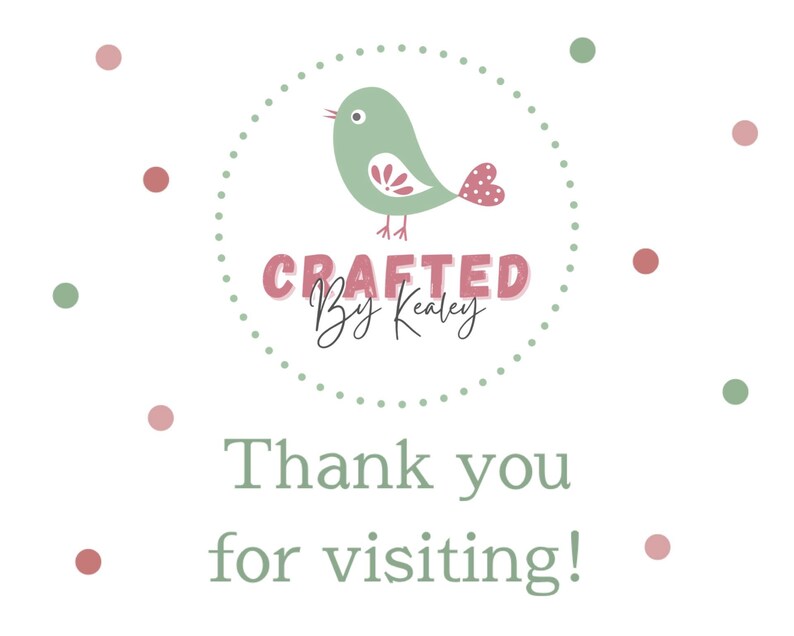May include: A white background with a circular design featuring a green bird with a pink heart-shaped tail. The text "CRAFTED By Kealey" is above the text "Thank you for visiting!" in a soft green color, with pink and green polka dots.