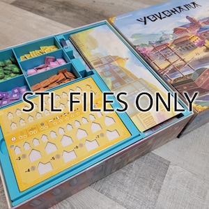 May include: A blue and yellow game organizer with a variety of compartments for storing game pieces. The organizer has a label that says "STL FILES ONLY".