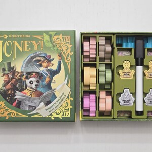 May include: A board game box and its contents are displayed. The box is green with the word "MONEY!" and illustrations of animal characters. Inside, various game pieces in pastel colors and a marker are organized.