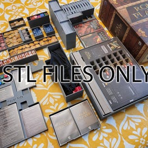 May include: An overhead shot of a board game organizer with various components. The organizer includes multiple trays and boxes for game pieces, cards, and dice. The text "STL FILES ONLY" is prominently displayed across the image. The game box is visible in the background.
