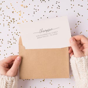 May include: A white envelope with a brown envelope inside. The white envelope has a handwritten address that reads "thompson 3018 RIVERWOOD STREET BRENTWOOD, TN 37027".