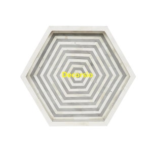 May include: A hexagonal tray with a white and grey striped pattern. The tray is made of bone inlay and has a raised edge.
