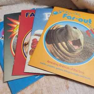 May include: A stack of four colorful children's activity books with the title "Far-out Fun" on the top book. The top book features a photo of a walrus with the text "Amazing Animals of the Sea" and "Inside: puzzles, games, things to make and to do".