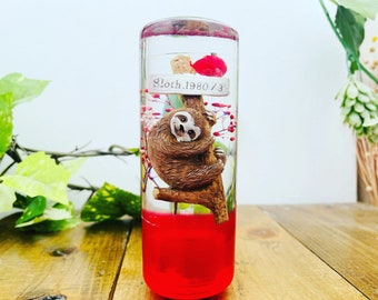 Bradipo e gipsofila con pomello del cambio sottomarino