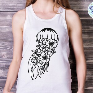 May include: White tank top with a black and white graphic of a jellyfish with flowers. The jellyfish is outlined in black and has a bell shape with a floral design.