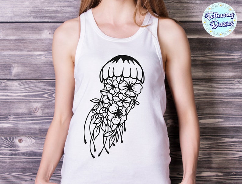 May include: White tank top with a black and white graphic of a jellyfish with flowers. The jellyfish is outlined in black and has a bell shape with a floral design.