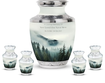 May include: A set of five silver and white urns with a misty forest scene. The largest urn has the text "In Loving Memory Of Your Loved One Name Here May 16, 1969 Oct 06, 2022".