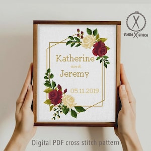 May include: A framed cross stitch pattern featuring a gold geometric frame decorated with red and cream roses and green leaves. The text reads Katherine and Jeremy with the date 05.11.2019. The logo Vlada Stitch is in the top right corner.