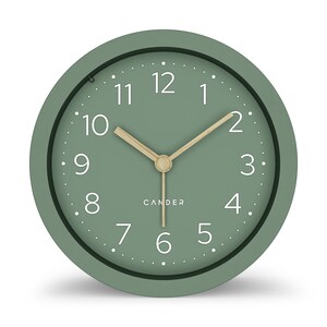 May include: A round, sage green analog clock with white numerals and a light wood-colored hour and minute hand. The clock face has a dotted minute track and the brand name "CANDER" is printed below the center.