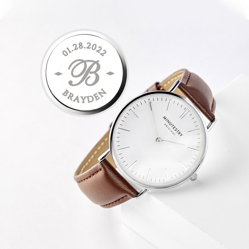 Classic watch with brown leather strap and engraved back featuring the name Brayden and the date 01.28.2022