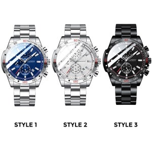 Puede incluir: Tres relojes de pulsera plateados y negros con funciones de cron&oacute;grafo. Los relojes tienen una esfera blanca, azul y negra con correas plateadas, plateadas y negras.