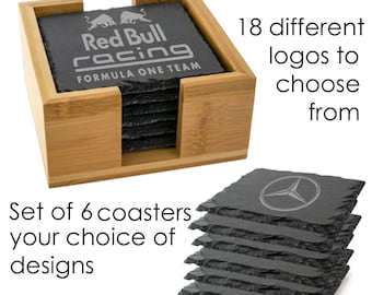 May include: Set of six black slate coasters with a bamboo holder. The coasters feature various logos, including Red Bull Racing.
