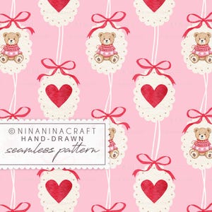 May include: A seamless pattern featuring repeating elements of teddy bears in sweaters and red hearts on scalloped tags, tied with red bows, against a pink background. The text "NINANINACRAFT HAND-DRAWN seamless pattern" is in a white rectangle.