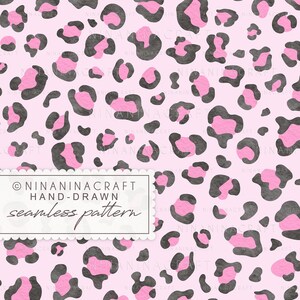 May include: A seamless pattern featuring a repeating leopard print design with dark grey and bright pink spots on a light pink background. A white rectangular label with scalloped edges displays the text NINANINACRAFT HAND-DRAWN seamless pattern.