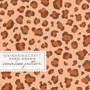 May include: A seamless pattern featuring a repeating leopard print design with dark brown spots and orange centers on a light peach background. A white rectangular label with scalloped edges displays the text NINANINACRAFT HAND-DRAWN seamless pattern.