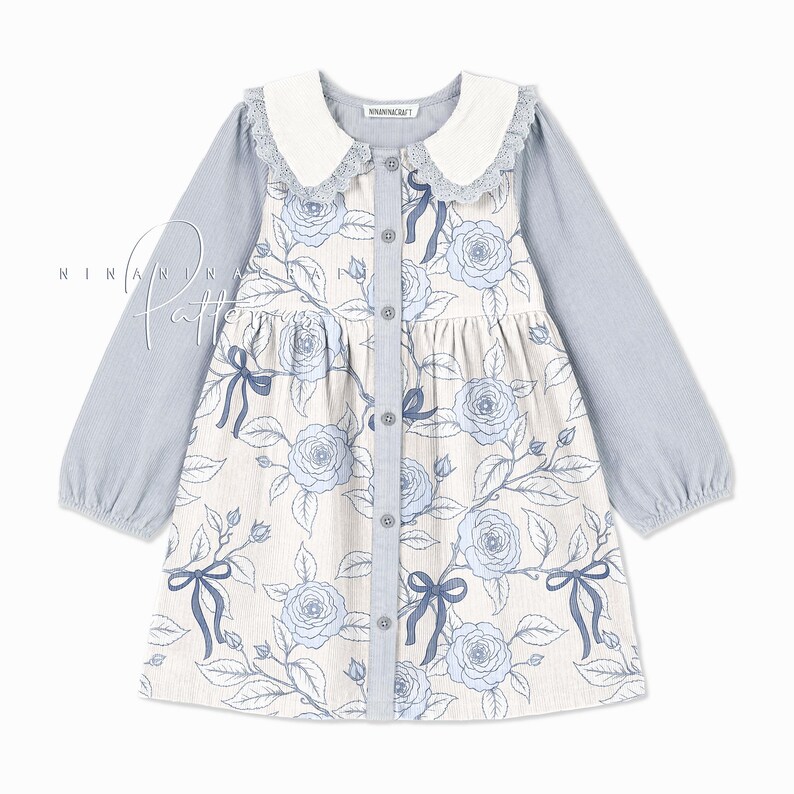 May include: A light blue corduroy dress with a white collar and long sleeves. The dress has a floral print with blue roses and bows. The dress has a button-up front.