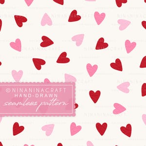 May include: A seamless pattern featuring hand-drawn red and pink hearts scattered on a cream background. The design includes the text "NINANINACRAFT HAND-DRAWN seamless pattern" in a pink rectangular frame.
