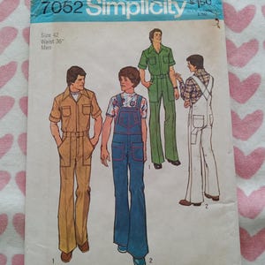 May include: Vintage Simplicity sewing pattern 7052 for men's clothing, size 42, waist 36 inches. The pattern features illustrations of various outfits, including jumpsuits and overalls, in shades of brown, green, and blue.