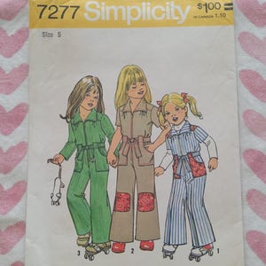 May include: Simplicity sewing pattern 7277 for children's jumpsuits. The illustration shows three children wearing different jumpsuit designs. The pattern includes a size 5. The text "$100" is visible.