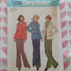 May include: Vintage Simplicity sewing pattern 7139 featuring three women in coats and pants. The pattern includes a size 10 with a 32 1/2 inch bust. The cover is light blue with the Simplicity logo and price.