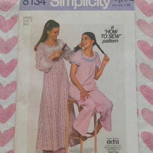 May include: Simplicity sewing pattern 8134 for a girl's nightgown and pajama set. The pattern cover features two women in pink sleepwear. The text on the cover reads "How to Sew" and "Super Sewing Extra".
