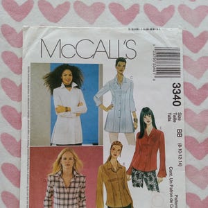 May include: McCall's sewing pattern envelope featuring illustrations of various button-down shirt designs. The envelope includes the number 3340, size BB (8-10-12-14), and the McCall's logo. The background is a pink and white heart pattern.