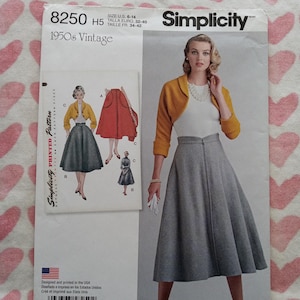 May include: Simplicity 8250 vintage sewing pattern. The pattern features a 1950s style skirt and bolero jacket. The pattern includes sizes U.S. 6-14. The image shows a woman wearing the outfit. The pattern is printed in the USA.
