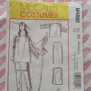 May include: McCall's Costumes pattern M4892. The package features illustrations of a Native American costume, including a fringed shirt, pants, skirt, and moccasins. The size is XM (Sml-Med-Lrg). The package has a yellow and white background.