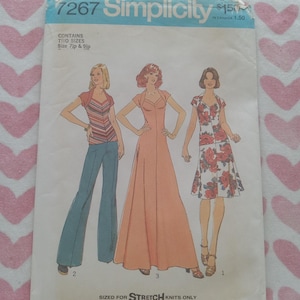 May include: Vintage Simplicity sewing pattern, number 7267, featuring three dress designs. The pattern includes sizes 7ip and 9ip. The cover shows illustrations of the finished garments, including a maxi dress and a floral print dress.