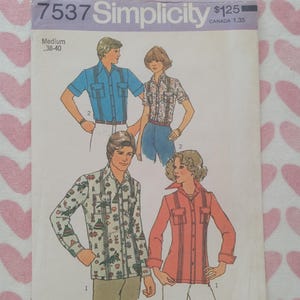 May include: Vintage Simplicity sewing pattern 7537 featuring illustrations of button-down shirts. The pattern cover has a light purple background with the Simplicity logo and the size Medium 38-40.
