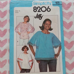 May include: Simplicity 8206 sewing pattern featuring three blouse designs. The pattern includes images of the finished blouses in various colors and styles. The pattern is size 12, Miss, and includes the word "Jiffy".