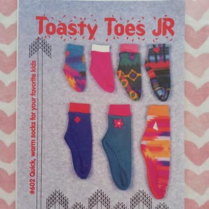 May include: A flyer for "Toasty Toes JR" socks, featuring various colorful sock designs. The socks include tie-dye, solid pink, patterned, and geometric designs. The flyer includes the text "#602 Quick, warm socks for your favorite kids."