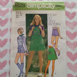 May include: Vintage Simplicity sewing pattern, size 10, featuring a green apron with pockets and a floral design. The pattern includes instructions for mini-length views and is for young junior/teens and misses' sizes. The bust size is 32 1/2 inches and the waist is 24 inches.