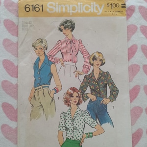 May include: Vintage Simplicity sewing pattern 6161 featuring illustrations of blouses. The pattern includes a size 12, bust 34 inches. The cover is yellowed with age and has the Simplicity logo.