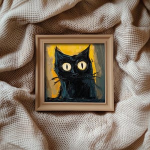 May include: A framed painting of a black cat with bright yellow eyes. The cat is painted in a stylized, almost cartoonish style, with thick black lines and a textured background.