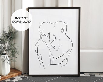 May include: A black and white line art print of two people embracing. The print is framed in a black frame and is hanging on a white wall.