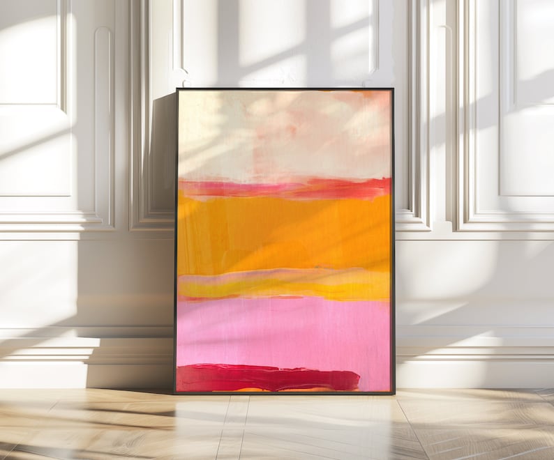 Puede incluir: Pintura abstracta con rayas horizontales en tonos de rosa, amarillo y naranja. La pintura est&aacute; enmarcada en negro.