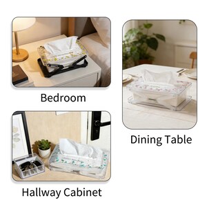 May include: Clear plastic tissue box with a floral design, shown in three different settings: bedroom, dining table, and hallway cabinet. The tissue box is rectangular and contains white tissues. The box is on a black stand.