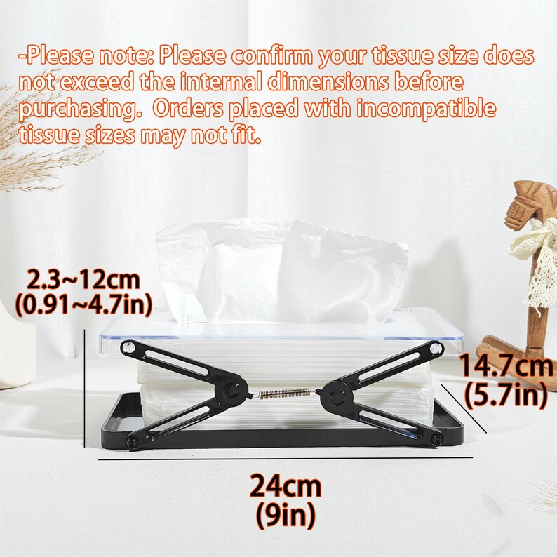 May include: A black tissue box holder with a clear lid, holding a stack of white tissues. The holder is 9 inches long and 5.7 inches high. The internal dimensions are 0.91 to 4.7 inches. The text on the image provides a note about tissue size.