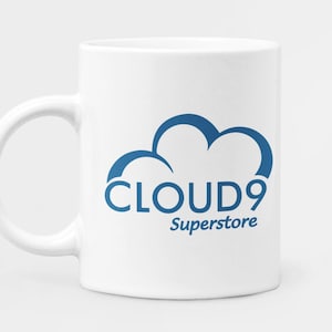 May include: White ceramic mug with a blue cloud graphic and the text "CLOUD9 Superstore" printed on it.