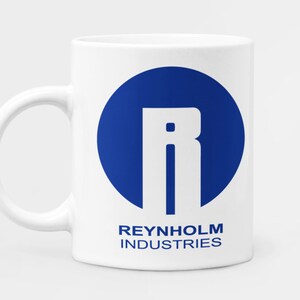 May include: White ceramic mug with a blue circle and a white letter R in the centre. The text "REYNHOLM INDUSTRIES" is printed below the circle.