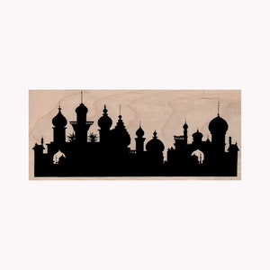 May include: Black silhouette of a city skyline with multiple domed buildings. The skyline is cut out of a piece of wood.