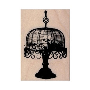 May include: Black and white image of a vintage cake stand with a domed lid. The stand has a decorative base and a delicate, ornate design.