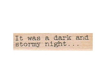 May include: A wooden stamp with the text "It was a dark and stormy night..." printed on it.