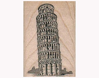 May include: A black and white line drawing of the Leaning Tower of Pisa on a light brown wooden background.
